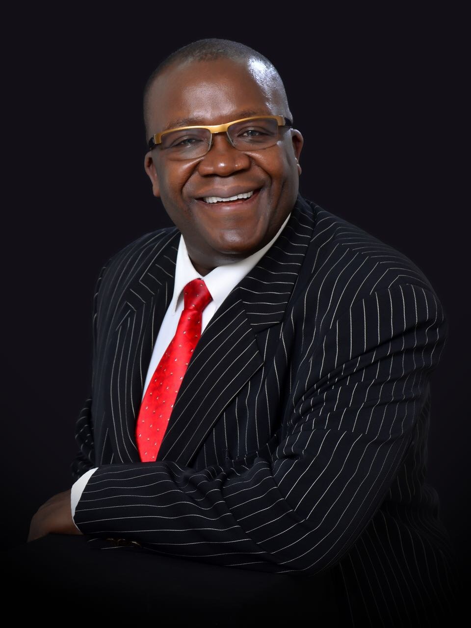 Dr. FCPA John Mudany