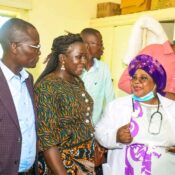 Dr Mildred Mudany, PhD briefs Hon. Moses Omondi on the medical camp activities at Ligega Health Centre.